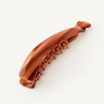 Banana Clip in Honey on a white background