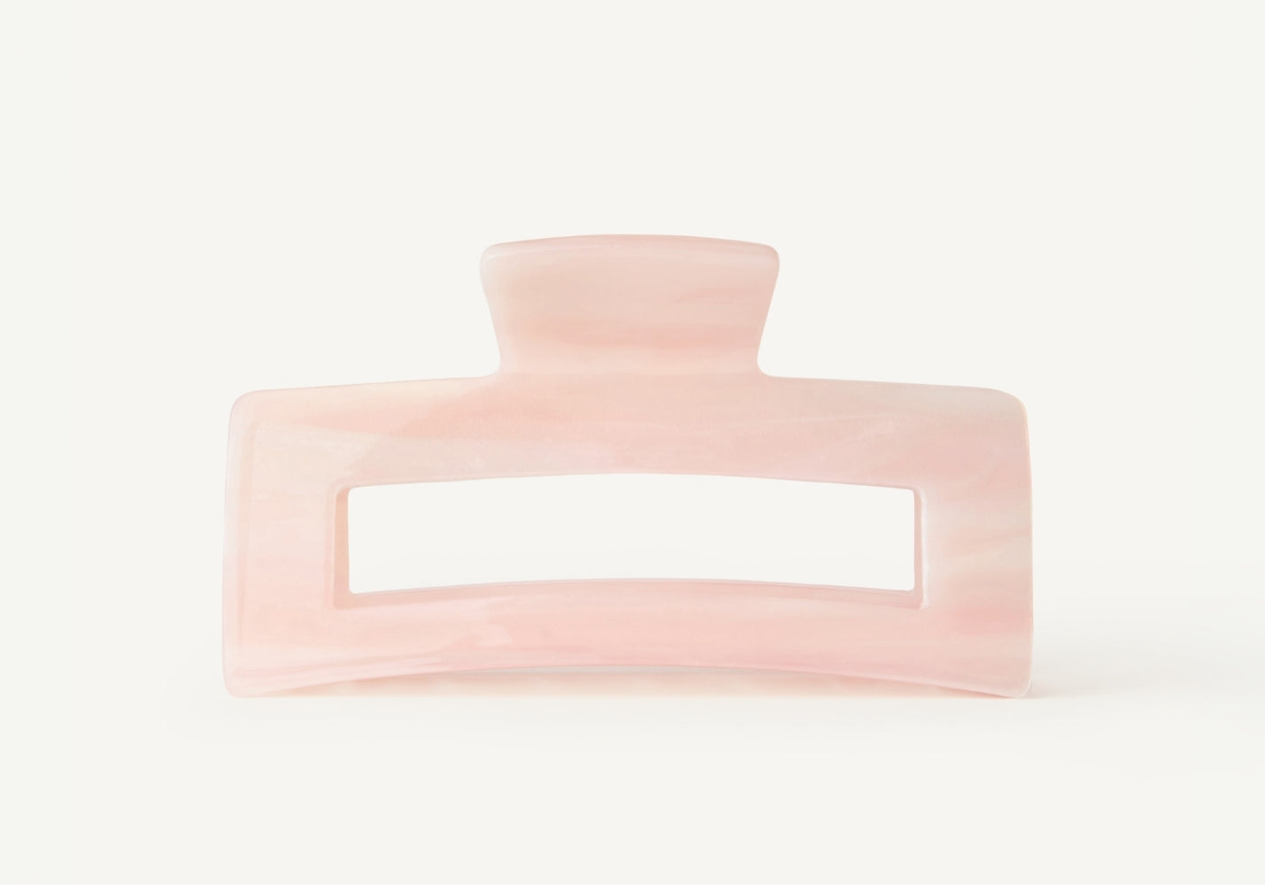 Pink hair clip on a white background