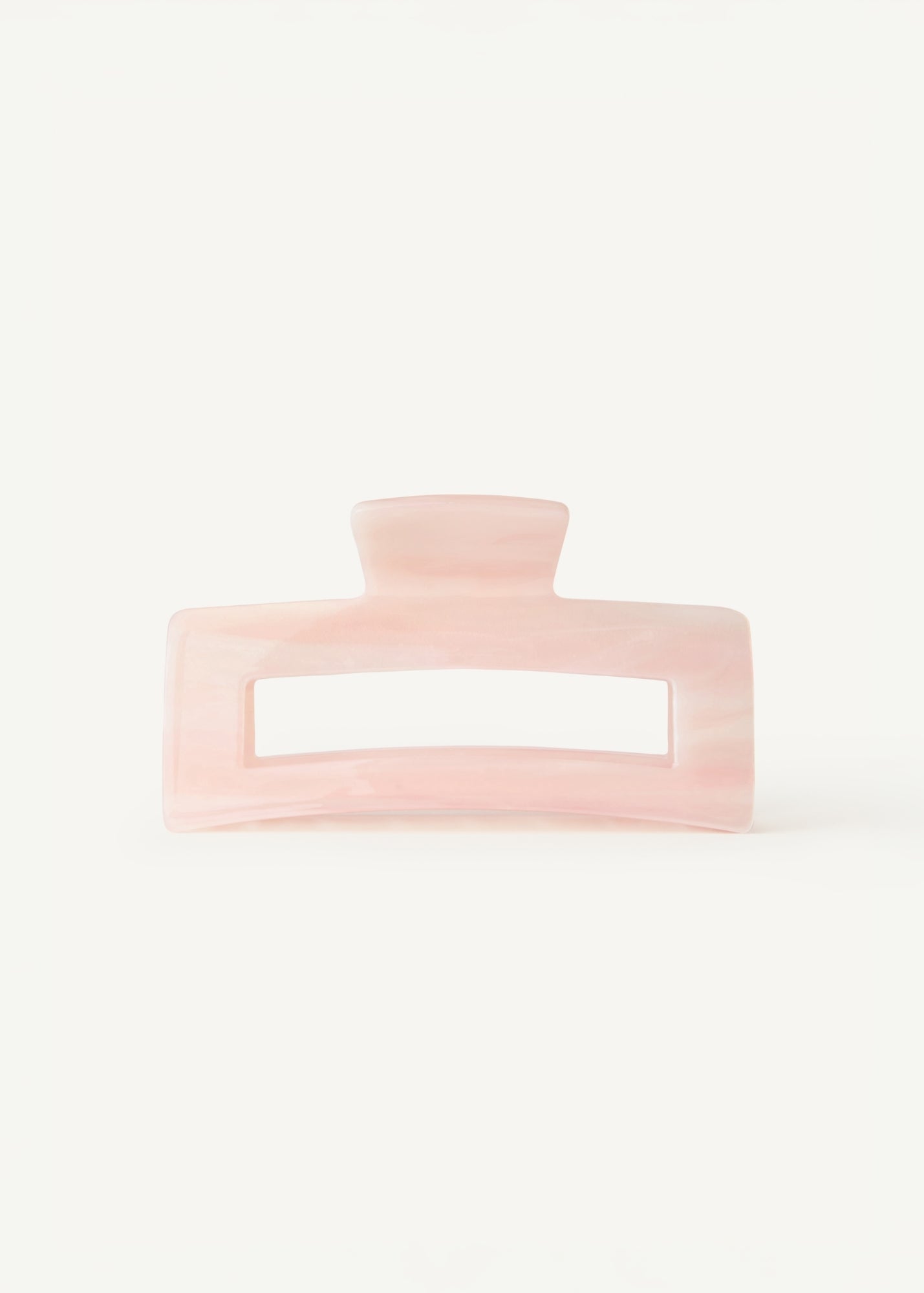 Pink hair clip on a white background