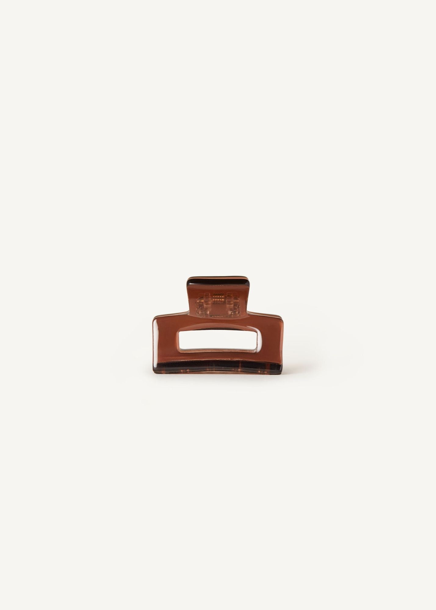 The Mini Daily Clip in cider, a mini hair clip, on a white background.