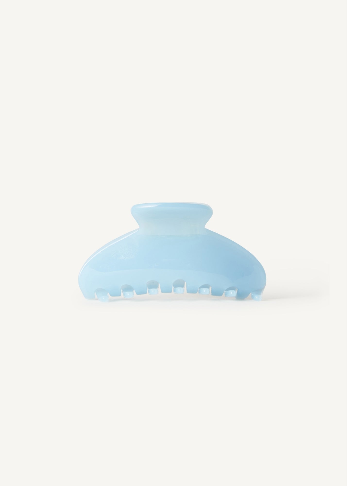 Light blue claw clip on a white background