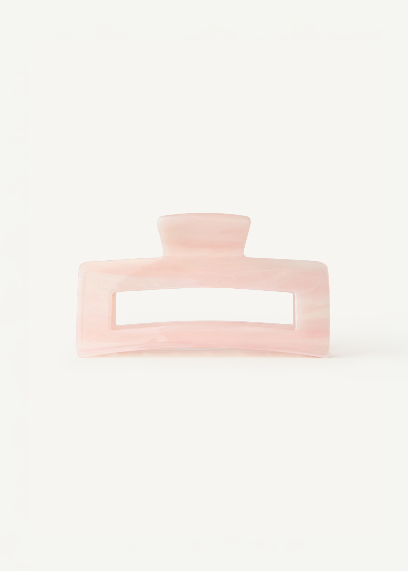 Pink hair clip on a white background