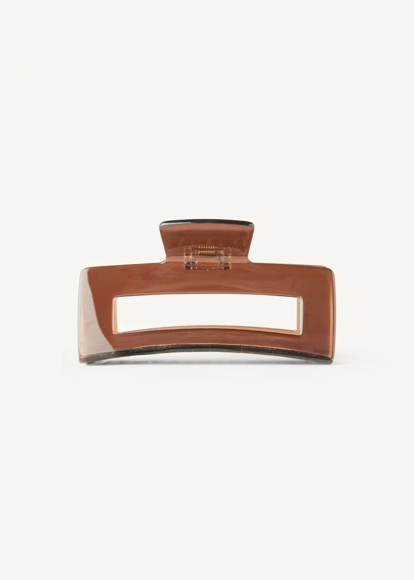 Brown hair clip on a white background