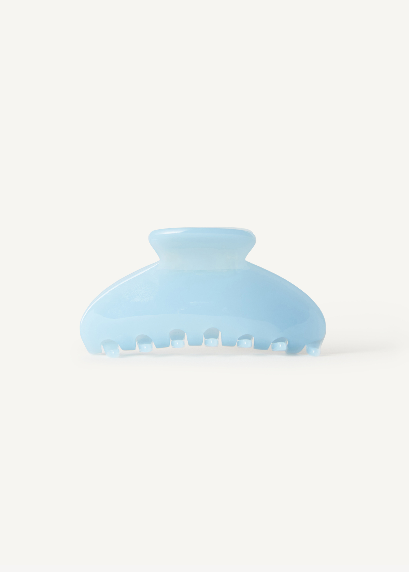 Light blue hair clip on a white background.