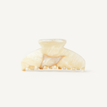 Cream claw clip on a white background.