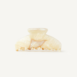 Cream claw clip on a white background.