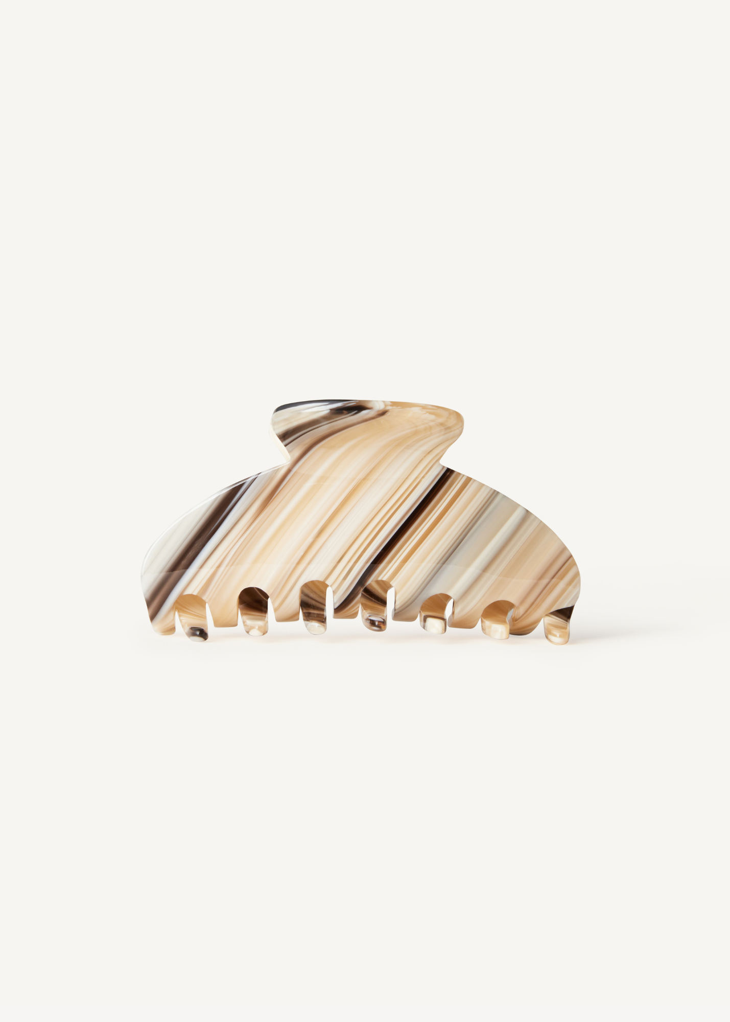 A striped pattern claw clip with beige, dark and light blue stripes on a white background