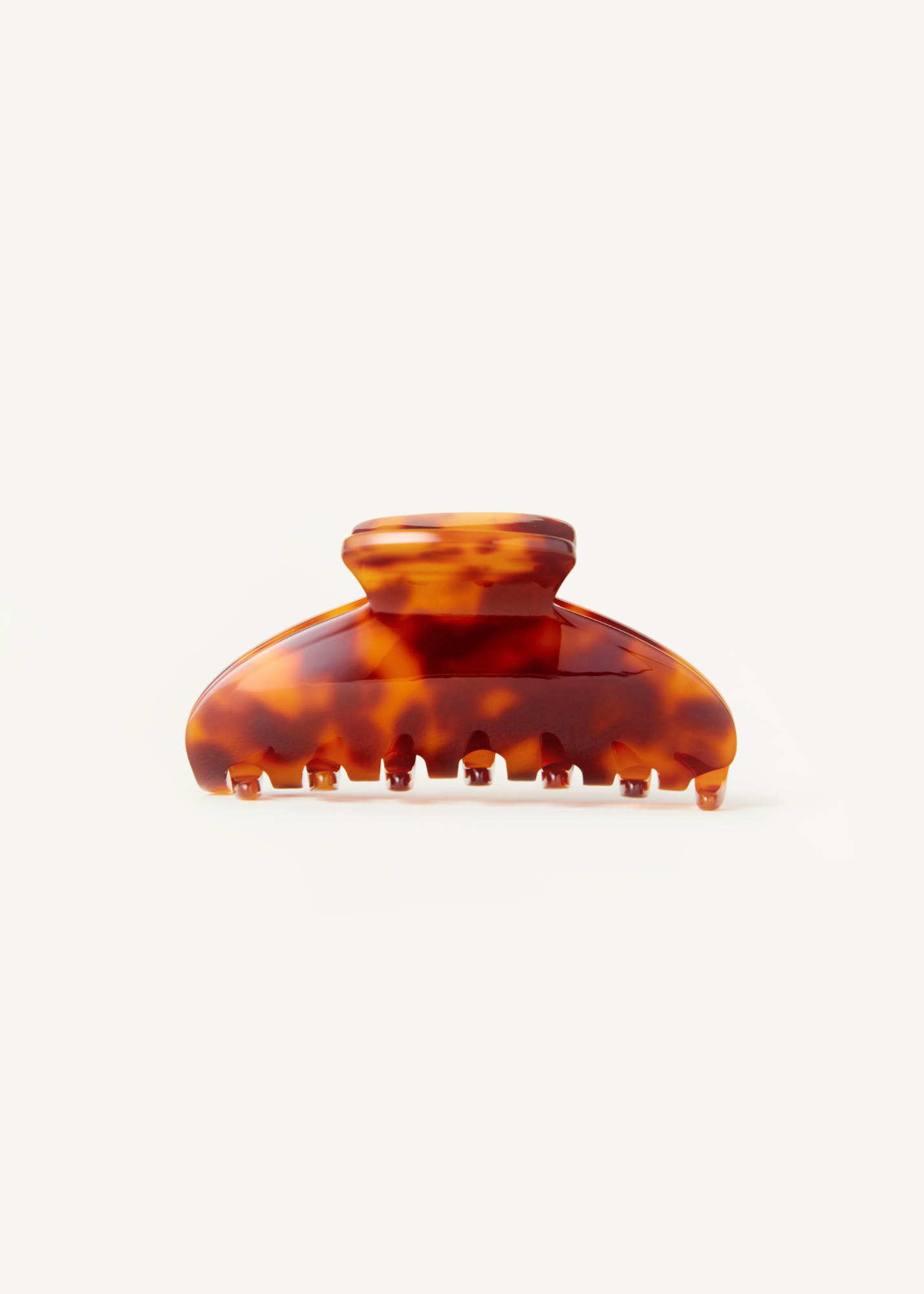 Tortoiseshell hair clip on a white background