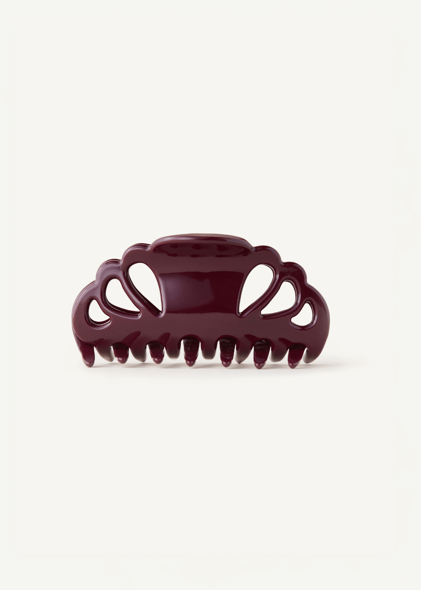 Icon Clip in a deep purple colour on a white background