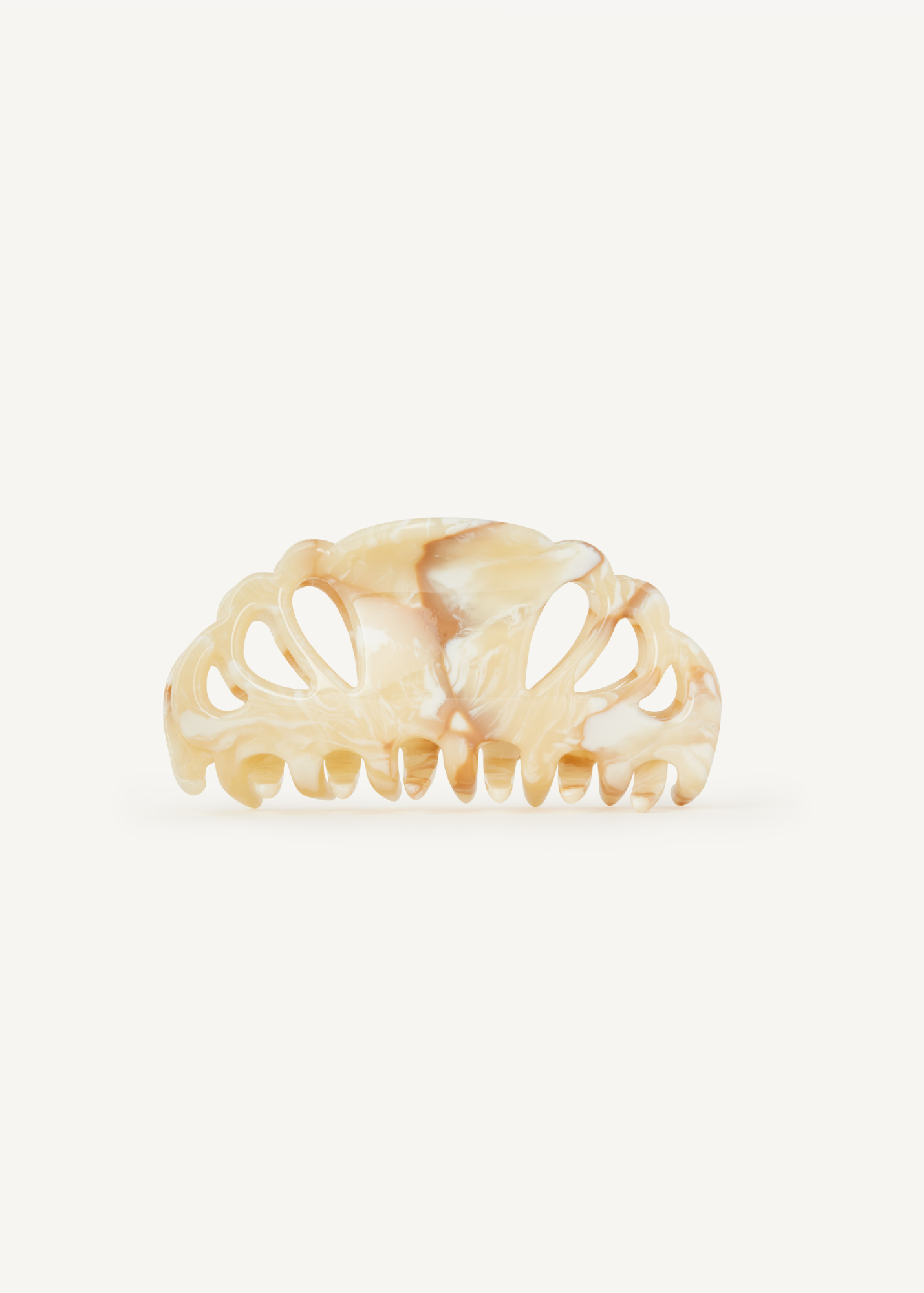 Beige hair clip on a white background