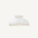 Pearl coloured hair claw clip on a white background