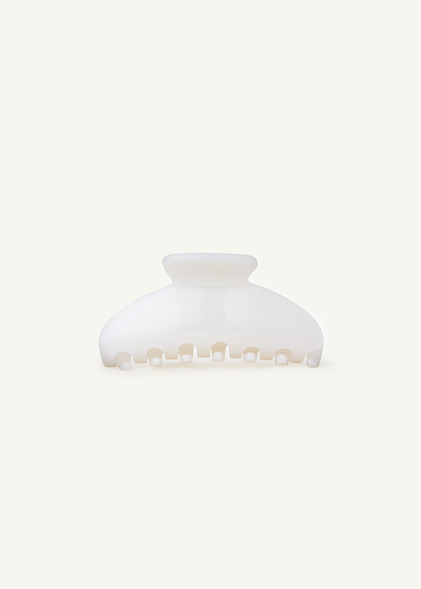 Pearl coloured hair claw clip on a white background