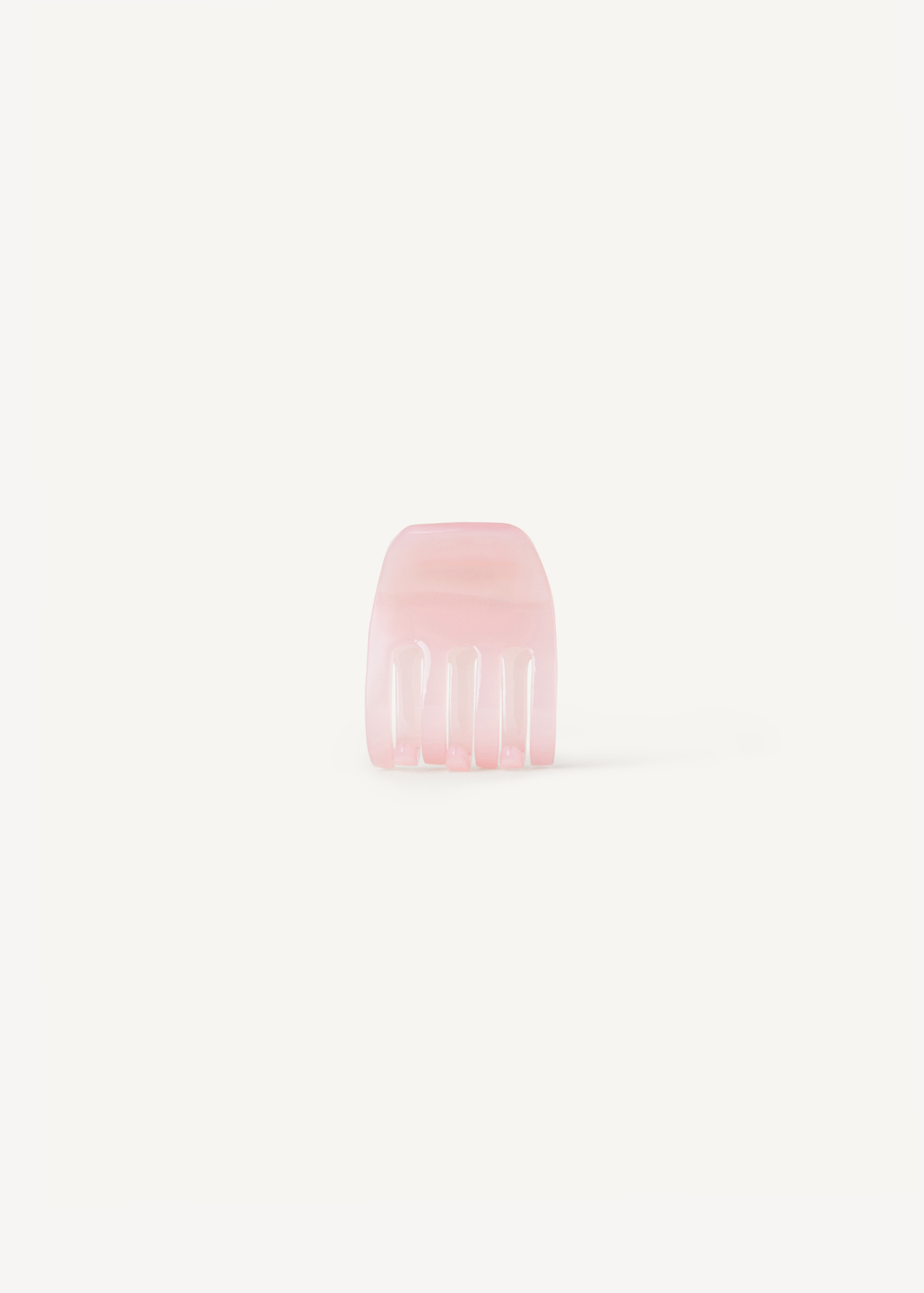 Small pink claw clip on a white background.