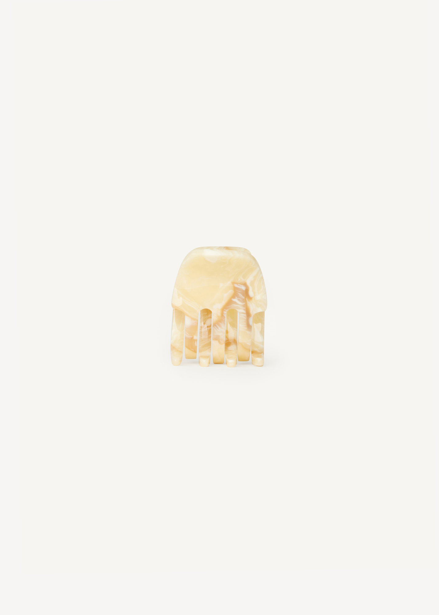 Small cream claw clip on a white background.