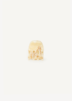 Small cream claw clip on a white background.