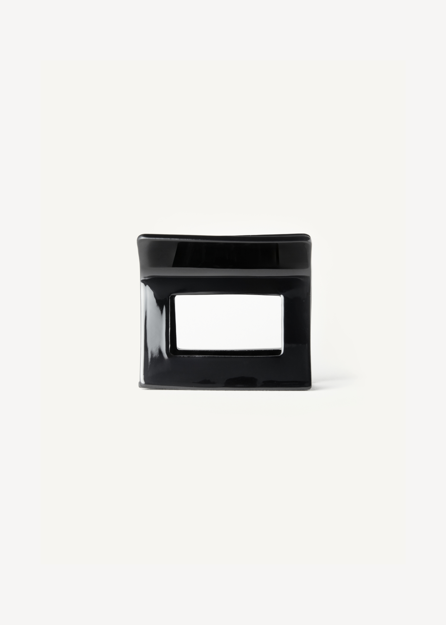 Black hair clip on a white background.