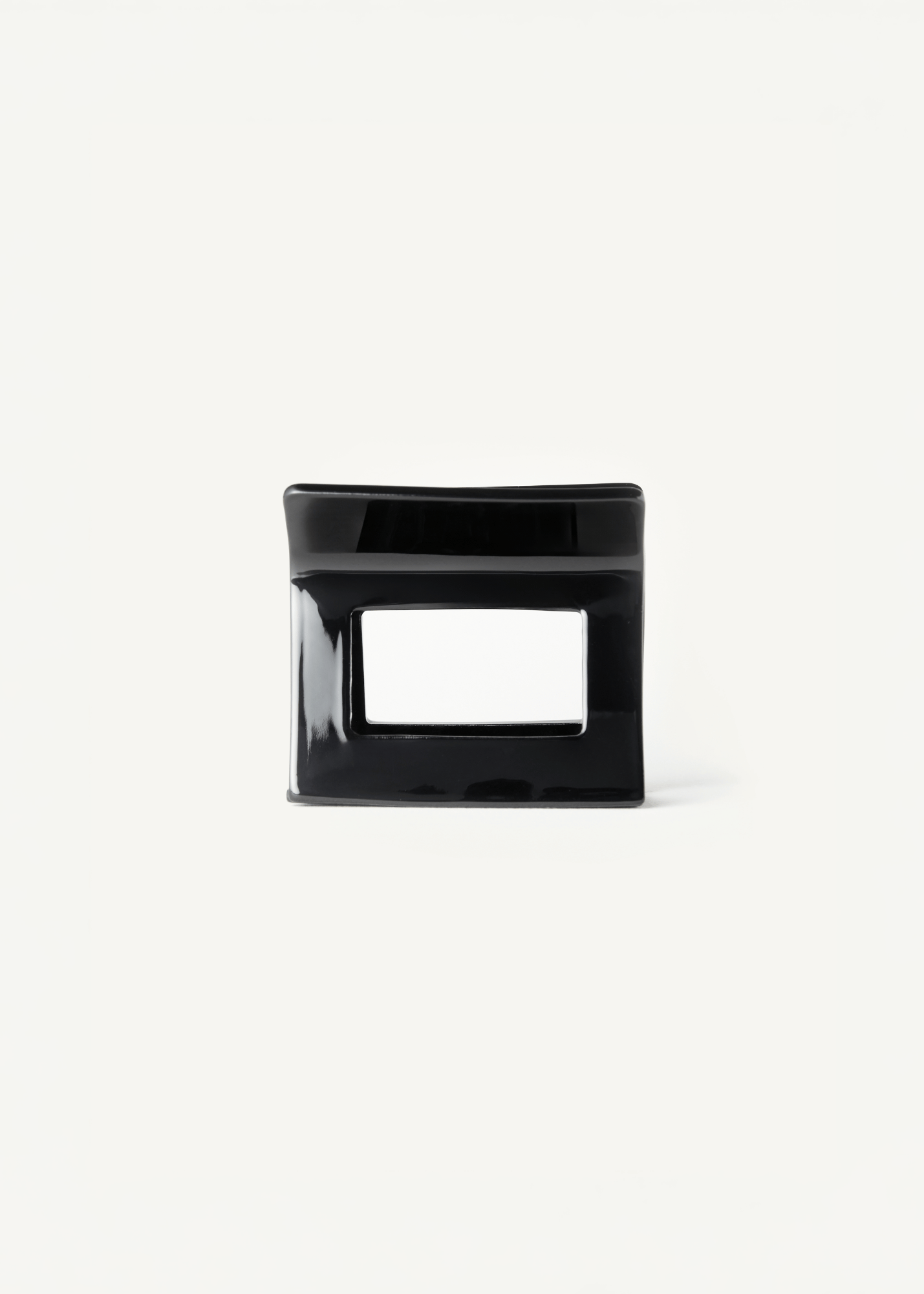 Black hair clip on a white background.