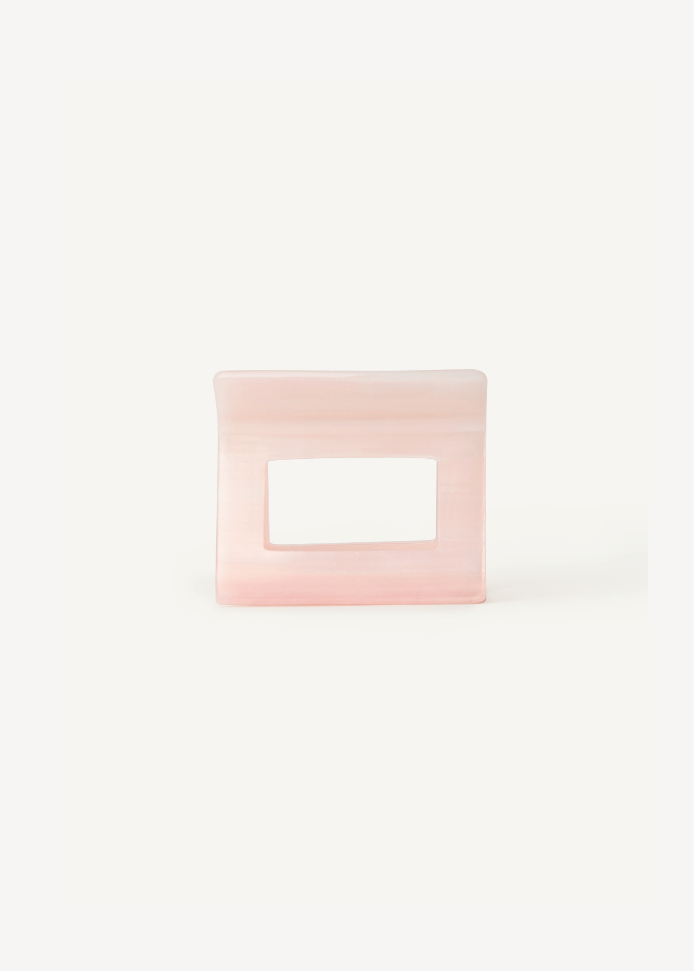 Pink hair clip on a white background.