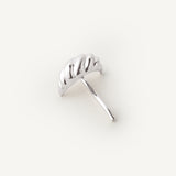 Silver croissant shaped hair accessory on a white background