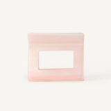 Rectangular pink hair clip on a white background