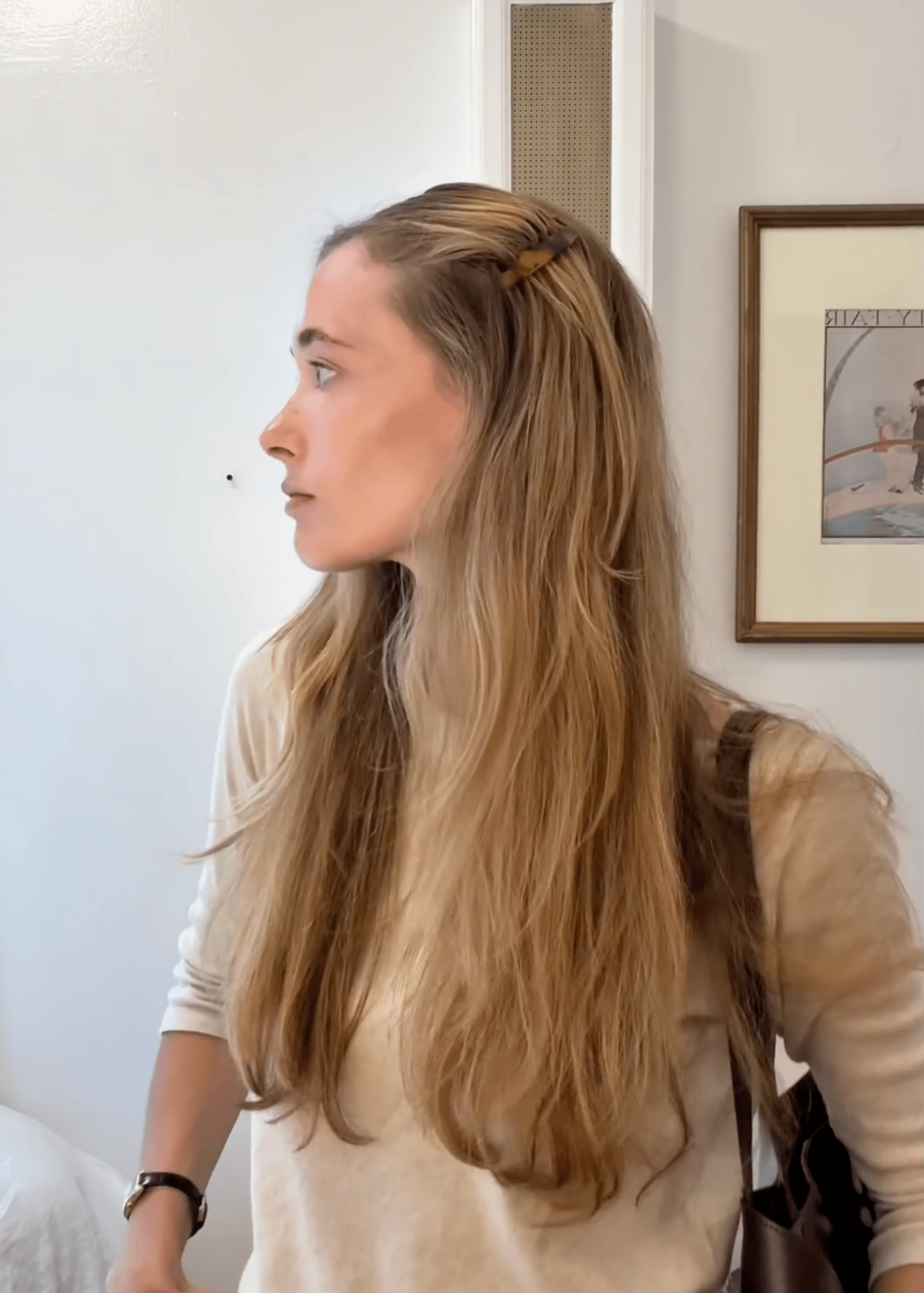 A video of a young woman demonstrating two ways to wear side combs. Once is a half up style while the other sweeps the hair away from one side of her face. 
